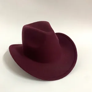 Detail view of burgundy felt wool cowboy hat with classic pinched crown and flat brim