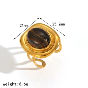 Golden stainless steel open ring with a large amber-colored oval natural stone inlay