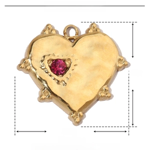 Detailed view of golden heart pendant with red rhinestone and precise size measurements