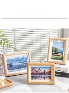 Detail of Nordic wooden frames with natural grain texture in a cozy sunlit room setting