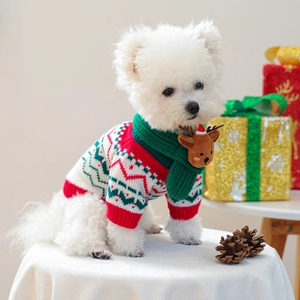 Close-up of knit pet Christmas scarf with reindeer decor and festive holiday gift boxes