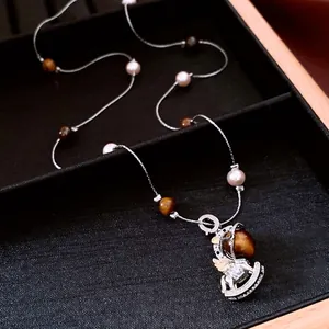 Tiger eye stone beaded necklace with vintage silver rocking horse pendant jewelry