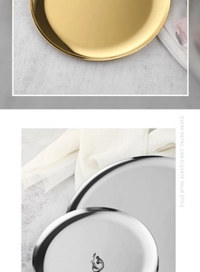 Macro shot of circular gold and silver metal trays with smooth polished surface
