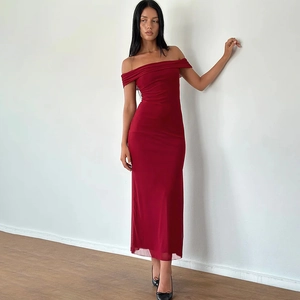 Detail shot of the off-shoulder neckline and bodycon fit on a burgundy mesh dress