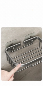 Detailed close-up showing the smooth polished edges of the wall-mounted metal shelf