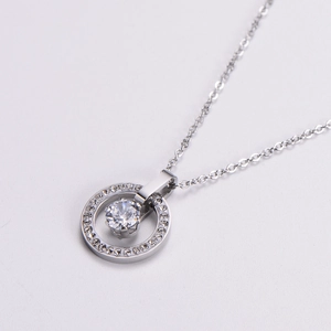 Silver nested circle pendant necklace with zircon stones and polished main stone