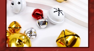 Macro shot of colorful Christmas bells with star cutouts on a white tiered background