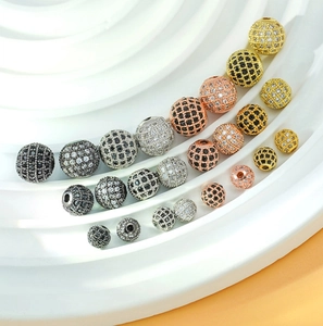 Macro shot of micro-pave zircon spacer beads in gold and silver for jewelry making