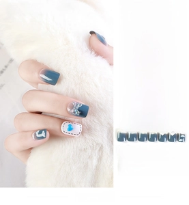 Detail of 24pcs blue gradient press-on nails with 3D bow and heart designs