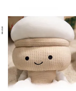 Close-up of a plush toy with embroidered smiling face and soft waffle texture fabric