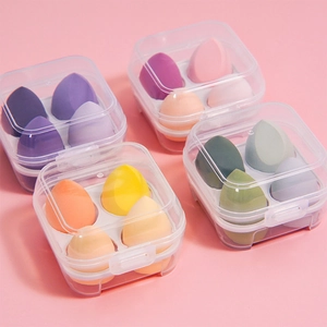 Set of 4 soft makeup sponges in a clear egg box storage case, multi-color beauty blenders
