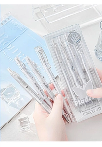 Close-up of translucent fluorite-style gel pens with matte silver printing in a clear box