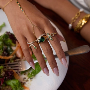 Elegant gold emerald zircon bracelet ring set featuring teardrop gemstone and snake design