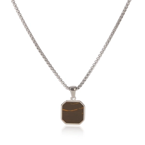 Macro shot of silver stainless steel necklace featuring a square brown tiger eye pendant