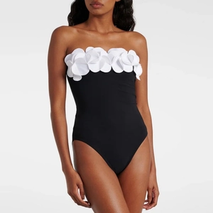 One-piece swimsuit with 3D white flower appliqué and black contrast strapless design