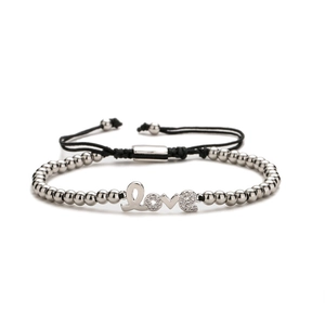 Silver bead bracelet with crystal-inlaid Love charm and adjustable black cord strap