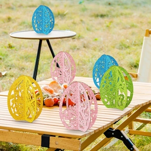 3D glitter Easter egg ornaments with bunny cutouts for festive tabletop decoration
