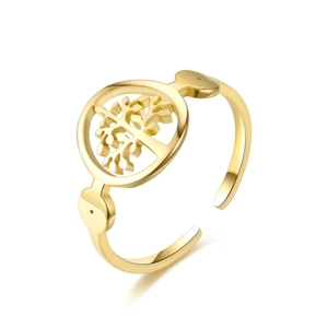 Close-up of golden open ring with intricate Tree of Life cutout design on a round disk