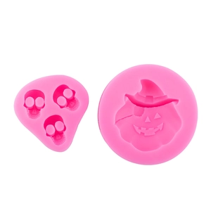 Pink silicone pumpkin and skull molds for Halloween baking and chocolate making