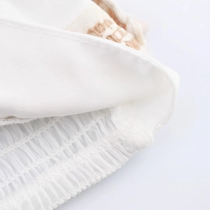 Close-up of white elastic lining and beige woven fabric for beach vacation set