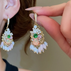 Detail of crystal drop tassel earrings with colorful rhinestones in a French palace style