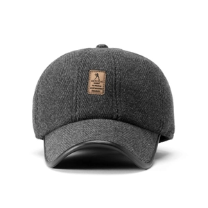 Detail of dark grey herringbone wool baseball cap with leather brim trim and logo patch