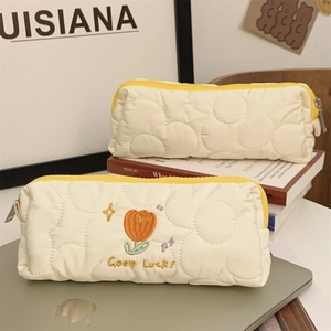 Quilted tulip embroidery pencil case set with orange floral patterns and yellow zipper