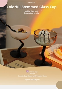 Artistic dessert glass with S-shaped black stem and elegant cream white bowl detail