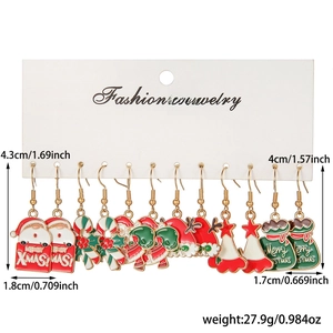 Detailed view of Christmas enamel earring set with dimensions and weight on display card