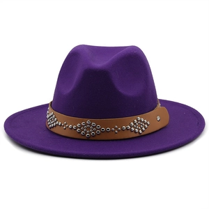 Detail of purple wool fedora with brown leather band and metallic rivet accents
