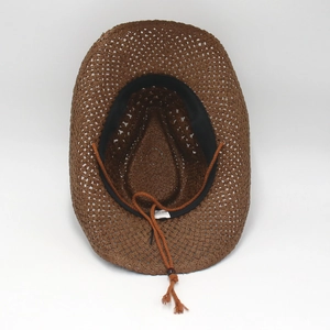 Detail of western straw hat showing 100% paper material label and interior sweatband
