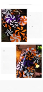 Detail of swirl pattern resin candy ornaments in festive orange, black and purple colors