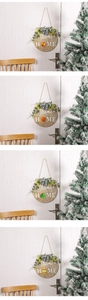 Close-up of circular wooden welcome sign with interchangeable seasonal magnetic icons