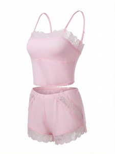 Detail view of pink lace patchwork camisole and shorts set with soft knit fabric