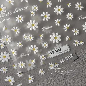 Detail of 5D embossed white daisy nail stickers with tactile petal texture and yellow centers