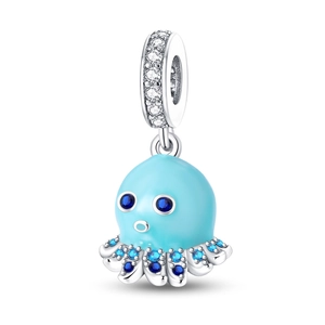 Macro detail of octopus charm with blue enamel and sparkling gradient cubic zirconia