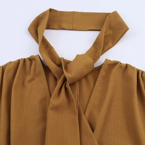 Elegant mustard yellow blouse featuring a scarf neck tie and delicate lace splicing detail