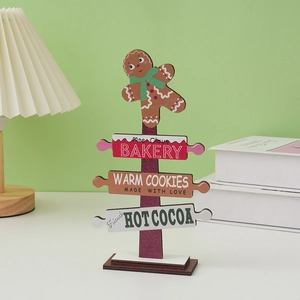 Wooden Christmas gingerbread man table ornament featuring Mrs. Claus Bakery sign