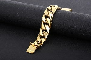 Detailed view of a 20mm wide gold-tone stainless steel Cuban link bracelet for men