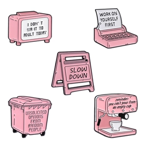 Pink cartoon enamel pins set featuring typewriter and oven designs with quotes