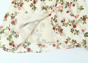 Detail of floral chiffon dress showing the hem stitching and double-layer lining structure