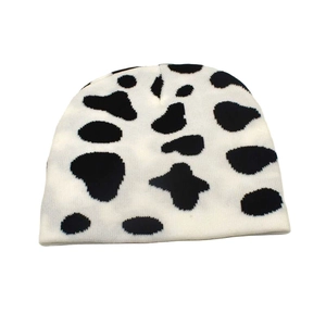 Autumn winter warm knitted beanie hat with classic black and white cow pattern print