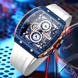 Macro view of blue and gold multi-function chronograph dial with white silicone strap