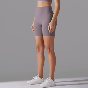 Detail of high waisted compression yoga shorts in dusty mauve with seamless stitching