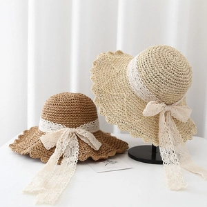 Straw sun hats with lace ribbons and scalloped brims in beige and dark coffee colors