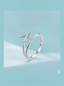 Macro shot of S925 sterling silver airplane ring with detailed zircon wing inlay