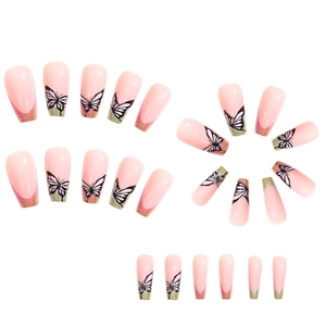 Detail of pink French coffin press-on nails with gold glitter edges and butterfly art