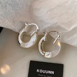 Silver metal hoop earrings with mother of pearl inlay and Confession engraving