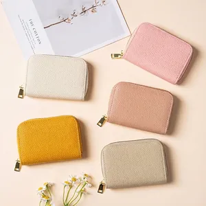 Minimalist RFID blocking leather card wallet in five pastel colors with gold zippers