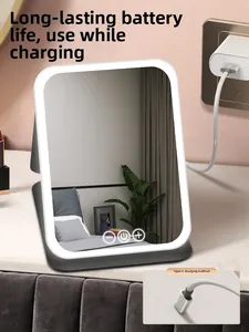 Detail of LED makeup mirror with Type-C charging port and touch control buttons